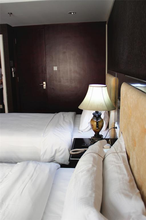 Manhattan Jinling Hotel Shanghái Habitación foto
